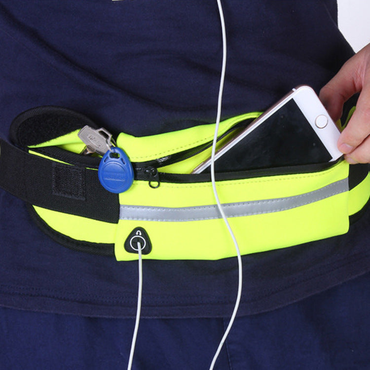 Running waist pack fanny bag, neon yellow on waist with phone and cord
