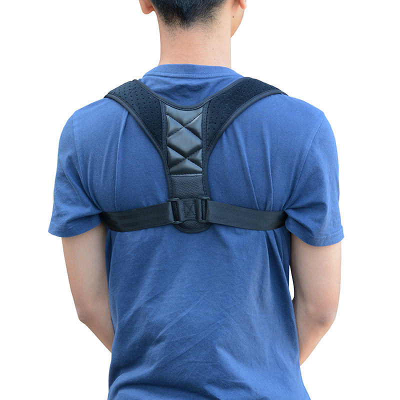 Posture support brace on blue T-shirt, padded back panel with quilted center detail.