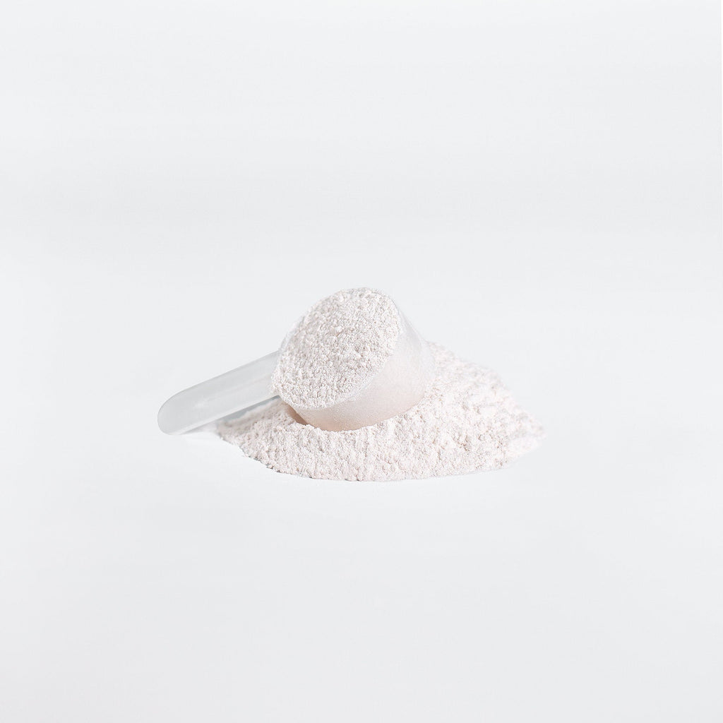 White powder pile with scoop for BCAA Shock Powder, Fruit Punch flavor