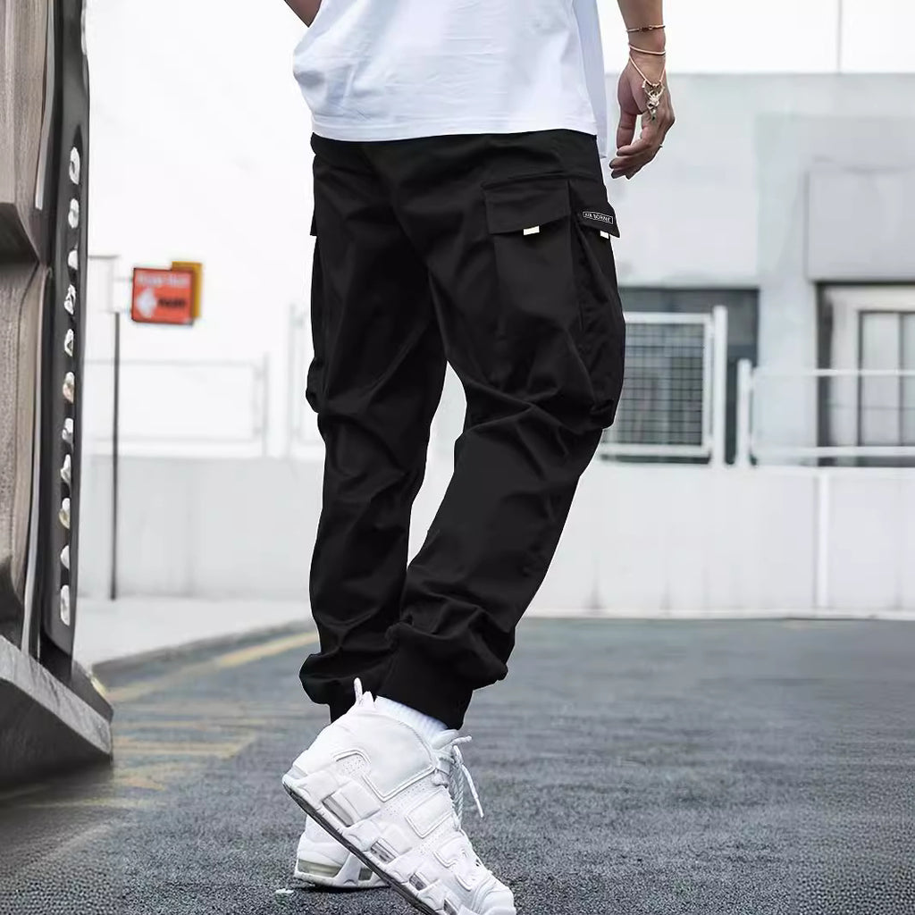 Black lightweight cargo pants with drawstring waist and roomy multi-pocket legs