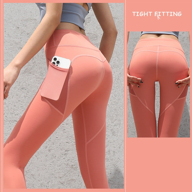 High-waist seamless leggings in coral pink with side phone pocket, close-up of back hips