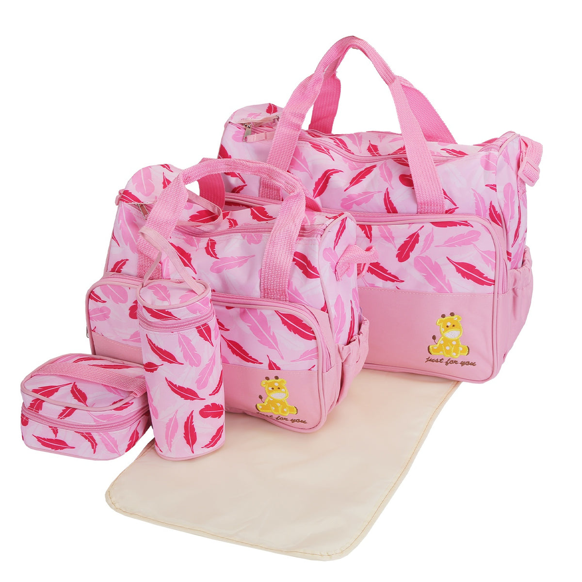 Light pink diaper bag set with patterned pouches and matching beige changing pad