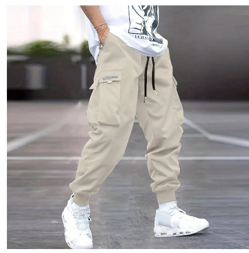 Khaki multi-pocket cargo pants with drawstring waist and cuffed ankles