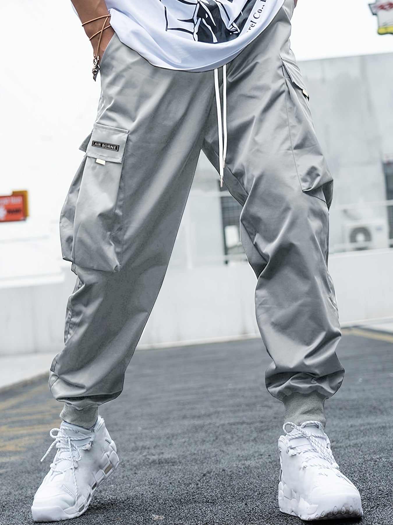 Gray lightweight cargo pants with drawstring waist and multi-pocket side cargo legs