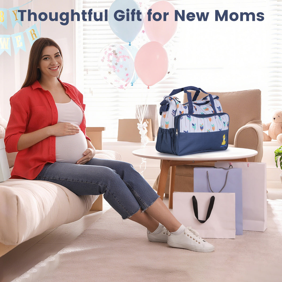 Navy diaper bag set with matching changing pad, shown on a table
