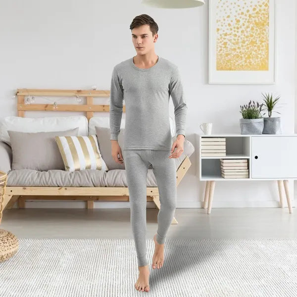 Grey men's thermal base layer set with long-sleeve top and fitted leggings, worn
