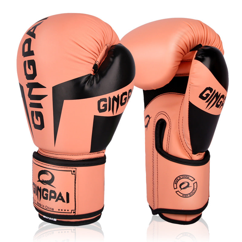Boxing training gloves in orange with black accents and curved wrist logo