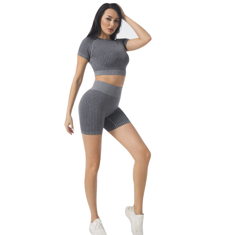 Dark gray seamless yoga crop top and high-waist ribbed biker leggings set