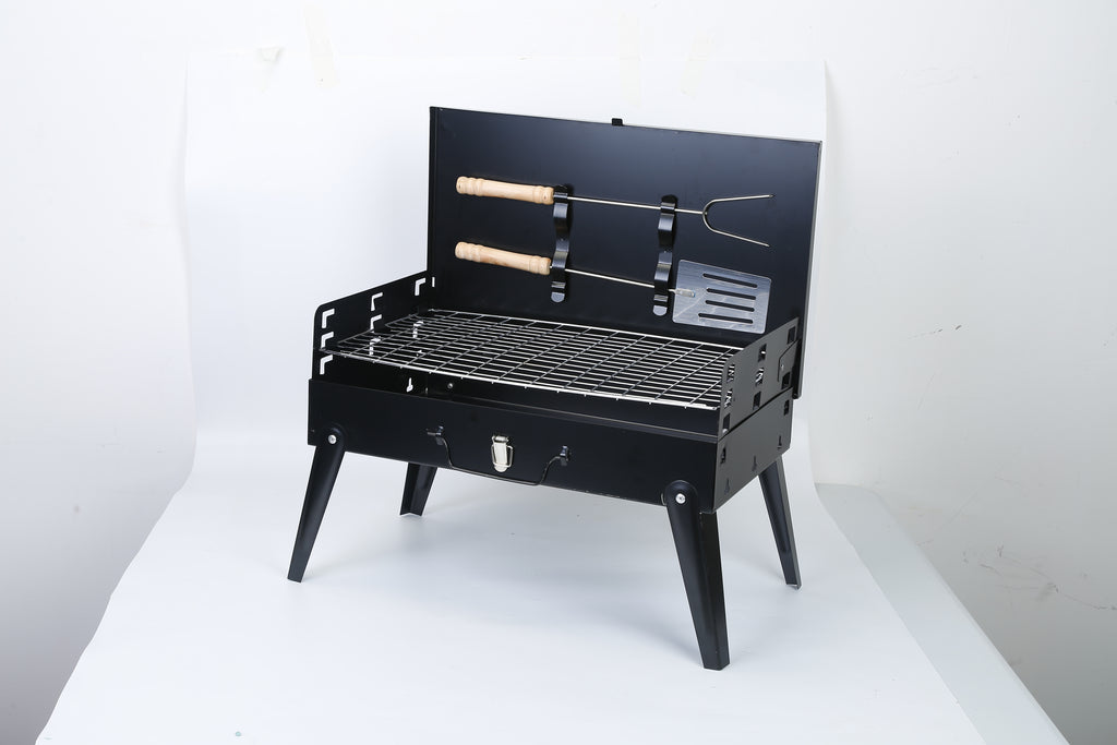 Black portable BBQ grill with lid open, wire cooking grate and attached utensil holders