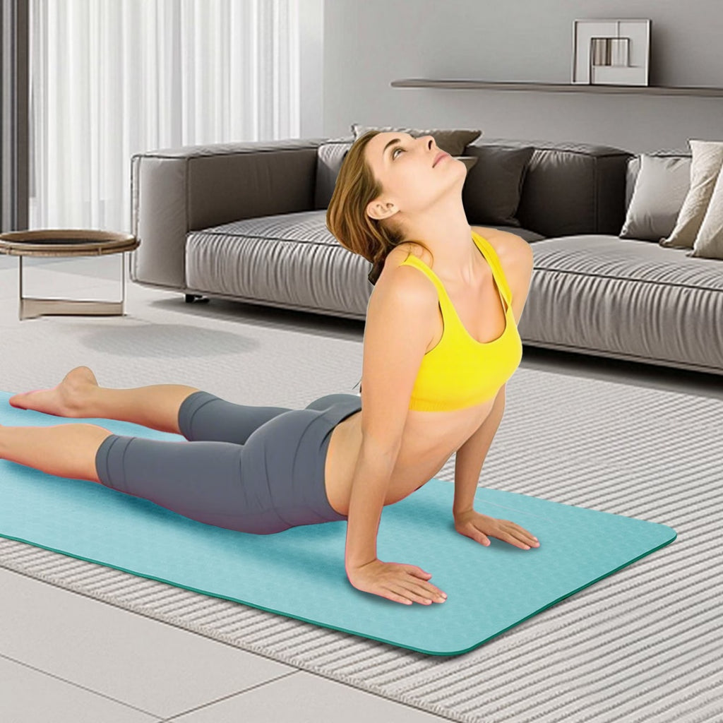 Turquoise yoga mat with a person performing a bridge pose