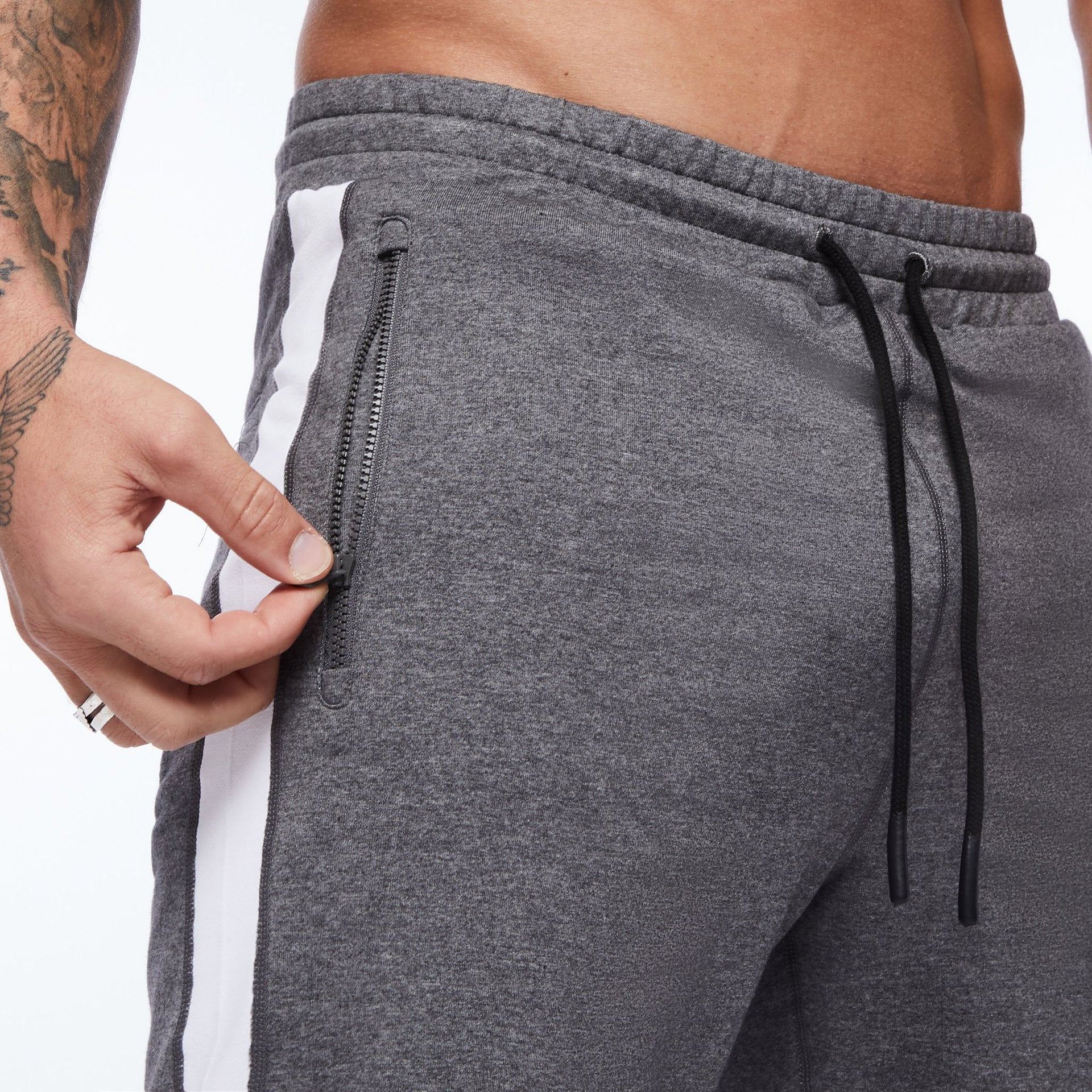 Heather grey running shorts with black drawstring, zip pocket, and white side panel