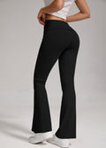 Black flare yoga leggings with fold-over high-rise waist and wide bell hem, side view