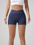 Navy blue V-waist running shorts, hip-lifting fit with seamless front and short hem
