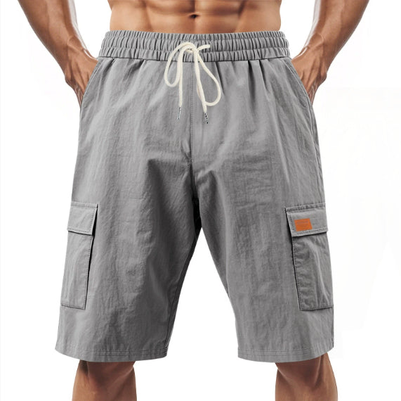 Slate gray men’s drawstring cargo shorts with side flap pockets and elastic waistband