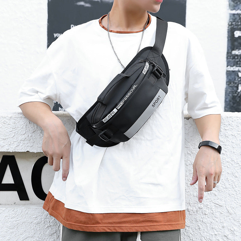 Black crossbody waist bag worn on chest with adjustable strap and front SPORT patch