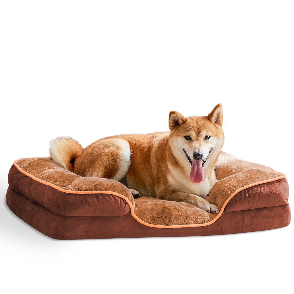 Brown pet bed with soft cushioned sides and orange-trim edge piping