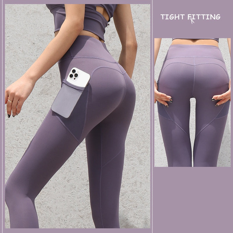 High-waist seamless leggings in purple with side phone pocket, front view of hips and thighs
