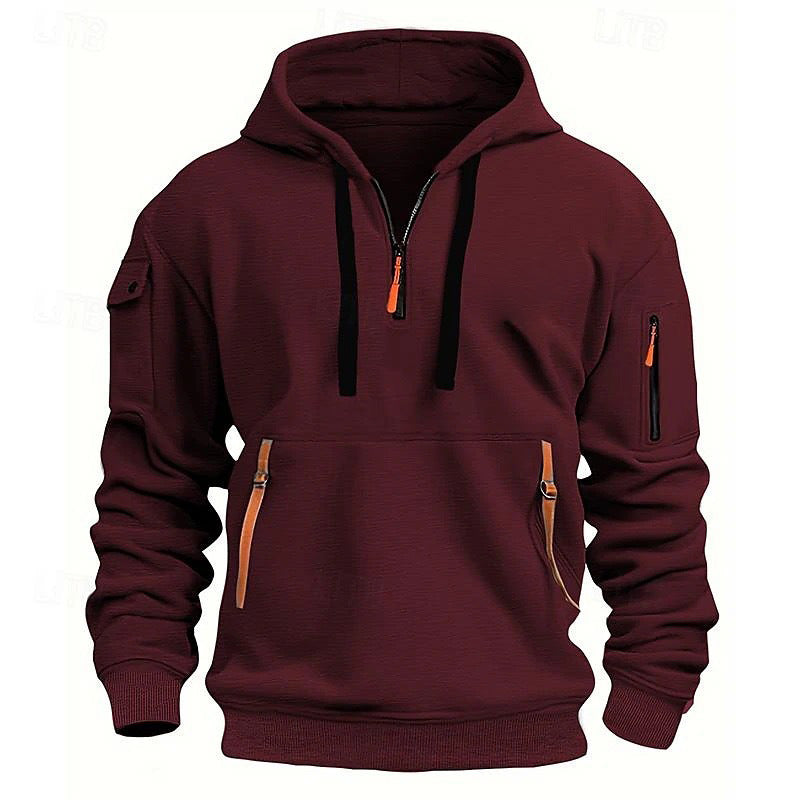 Oversized maroon pullover hoodie with hood, black drawstrings, kangaroo pocket, sleeve zip