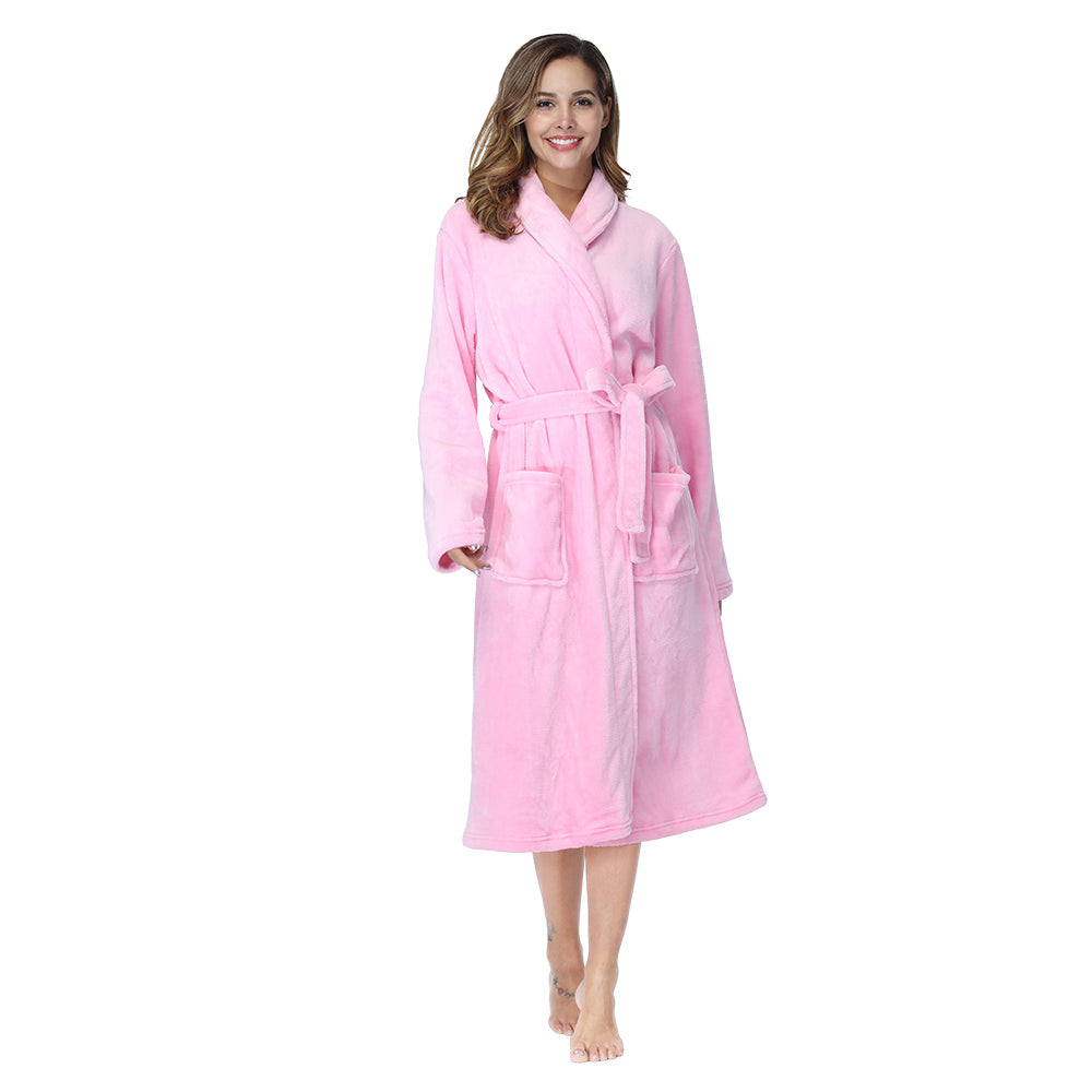 Light pink women’s bathrobe with shawl collar, belt and two front pockets, standing pose