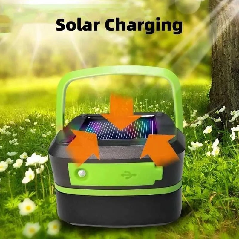 Solar camping lantern with green handle and black base, showing charging arrows over solar panel