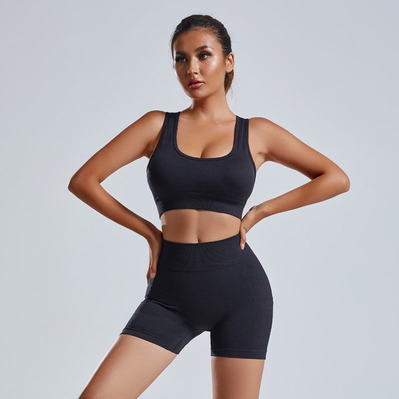 Black 2-piece yoga set with scoop sports bra and high-waist shorts