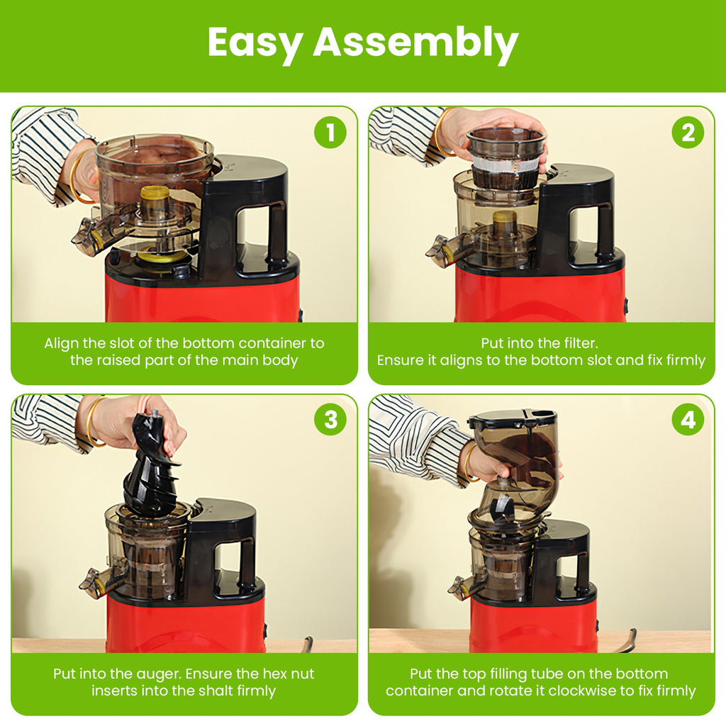 Red cold press juicer during assembly with clear filter and top parts attached.