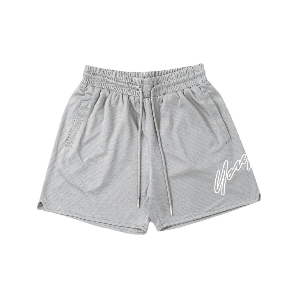 Light gray quick-dry training shorts with elastic waistband and drawstring, side logo.