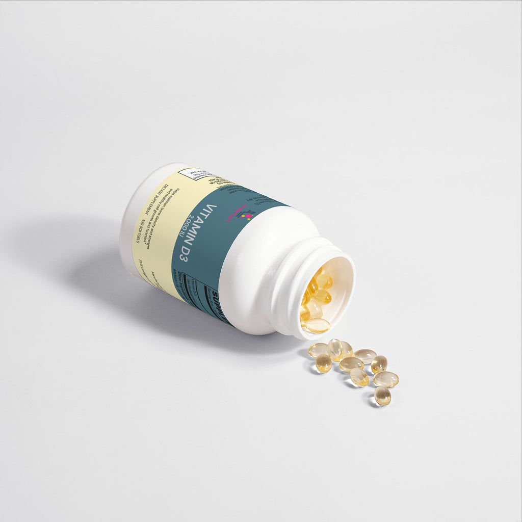 Vitamin D3 2000 IU bottle lying down with several amber softgels nearby