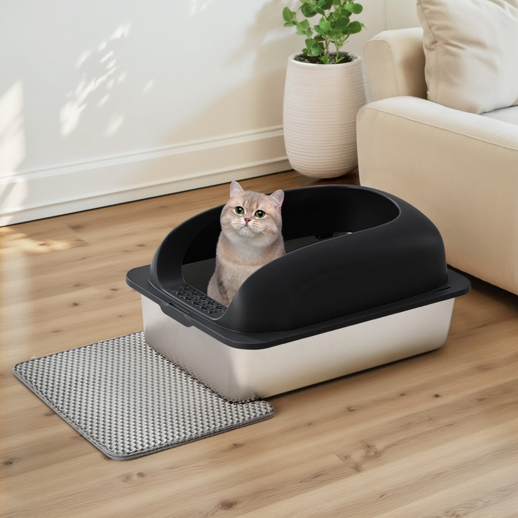 Covered cat litter box with black hood and stainless steel base, with textured mat