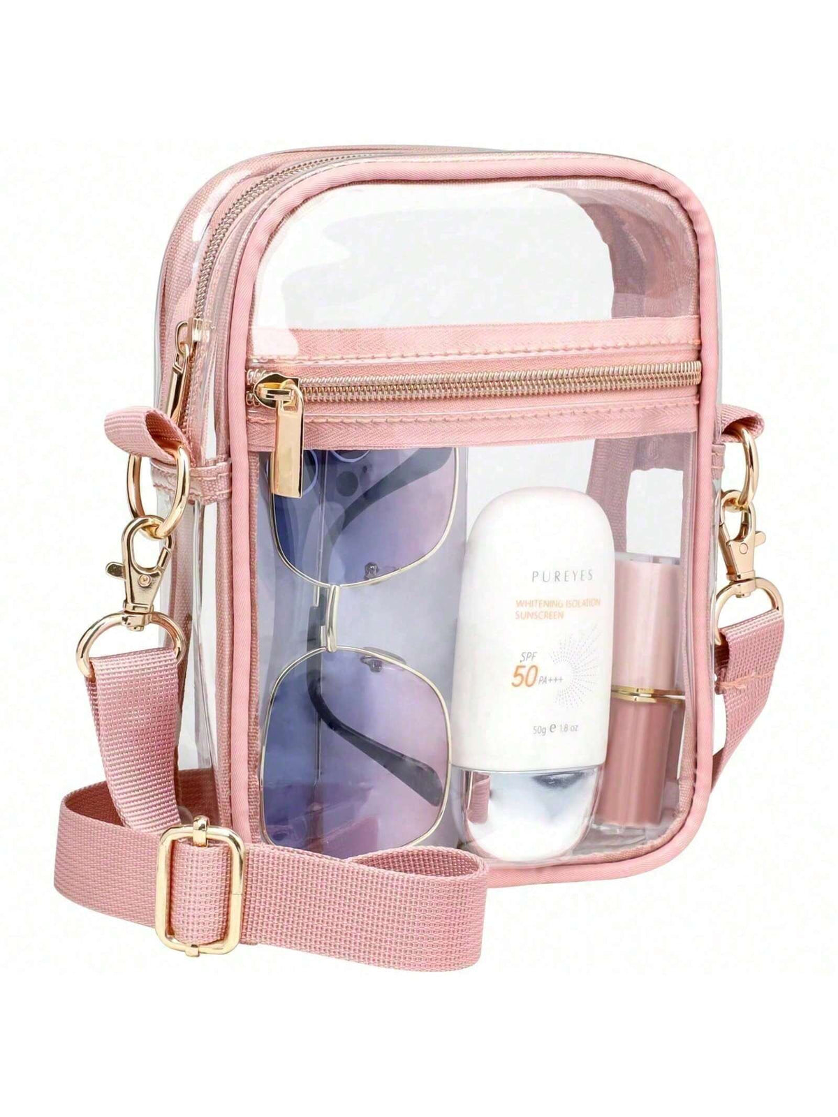 Pink clear crossbody bag with adjustable strap and rounded zip front design