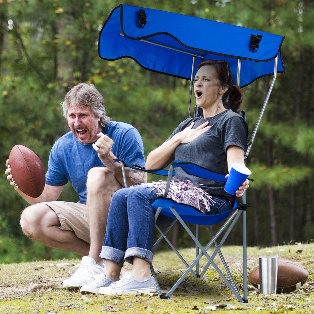 Blue foldable camping chair with canopy and cup holder on arm