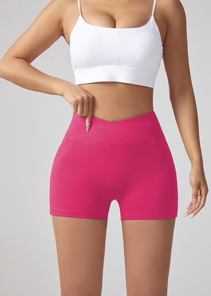 Rose red running shorts with V-waist and flat front, hip-lifting shaped silhouette