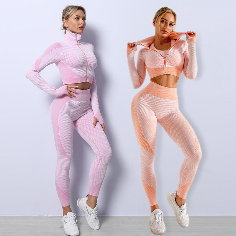 Seamless 3-piece workout set in pink and peach: zip crop tops and high-waist leggings.