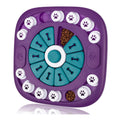 Purple interactive dog puzzle toy with teal bone tiles and treat pockets around the ring