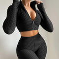 Black long-sleeve zip crop top and matching high-waist shorts tracksuit set