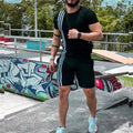 Black striped short-sleeve tracksuit set with side stripes and matching shorts