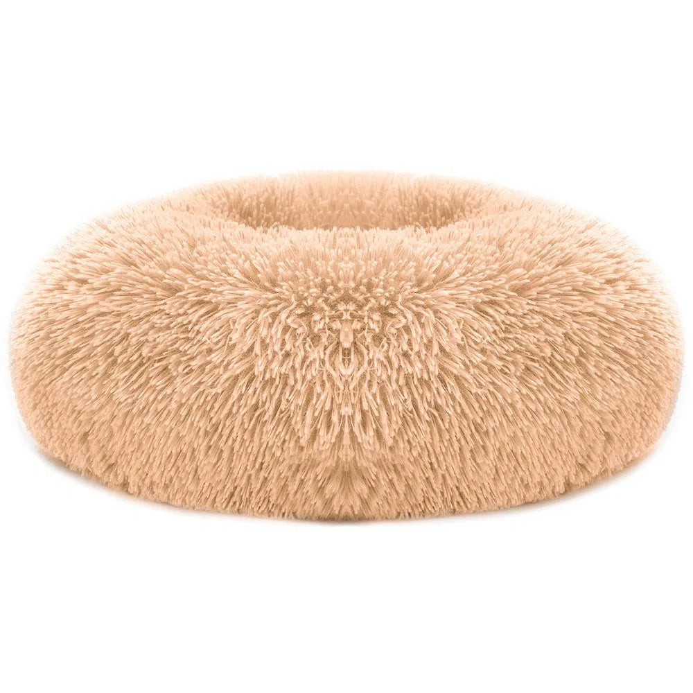 Tan plush oval pet sofa bed with shag fleece texture and raised center