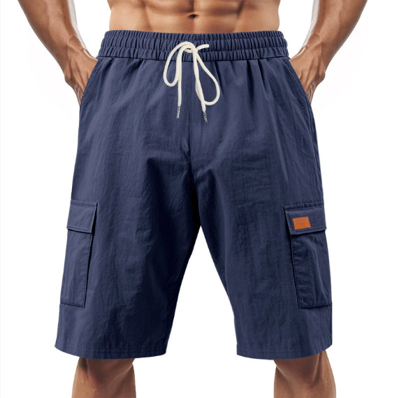 Navy men’s drawstring cargo shorts with elastic waistband and side flap pockets