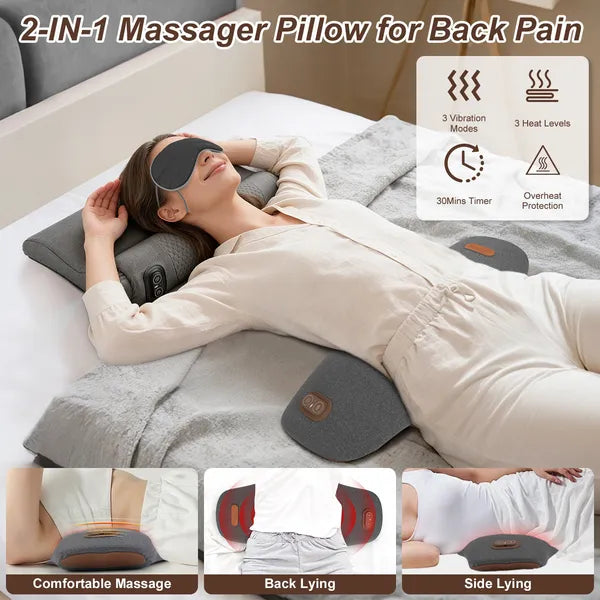 Dark grey lumbar massager pillow on bed with remote-style control and heat indicators