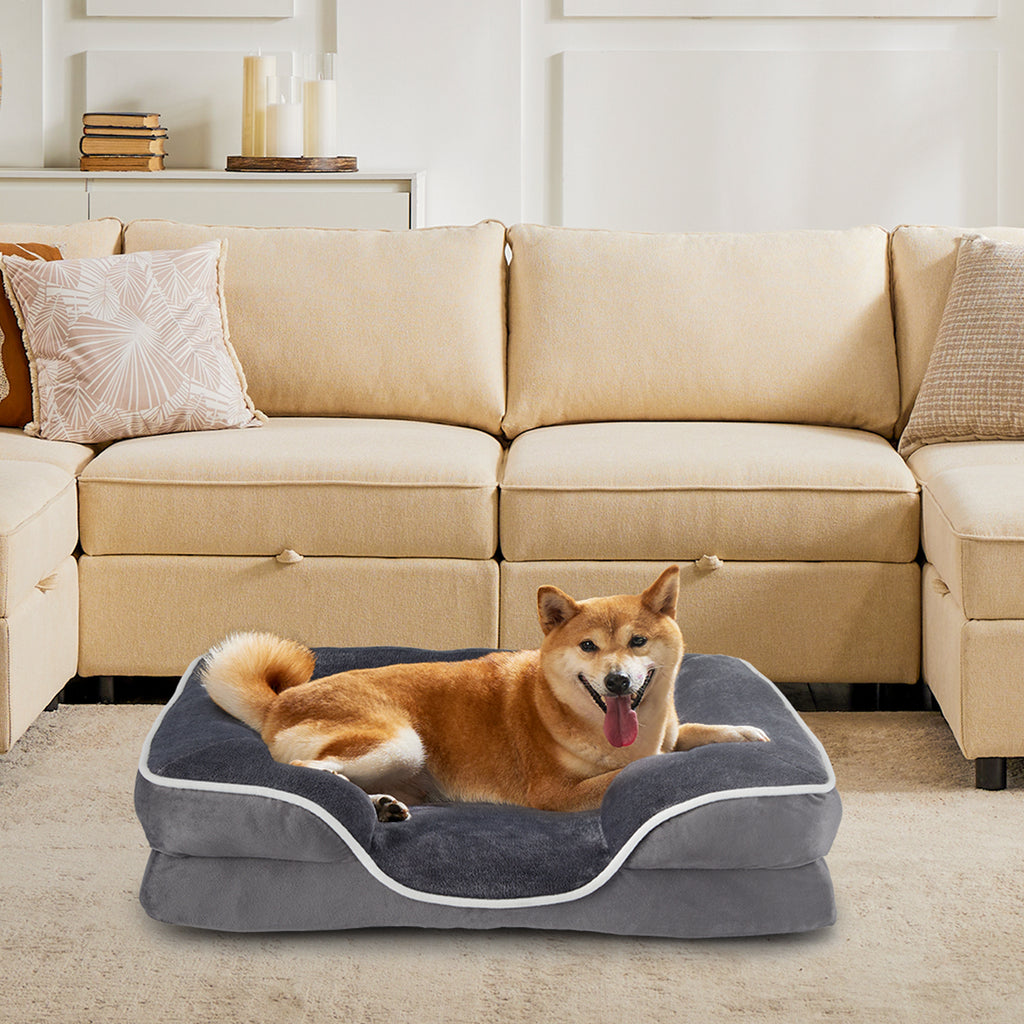 Brown pet bed with grey interior lining and plush cushioned side bolsters
