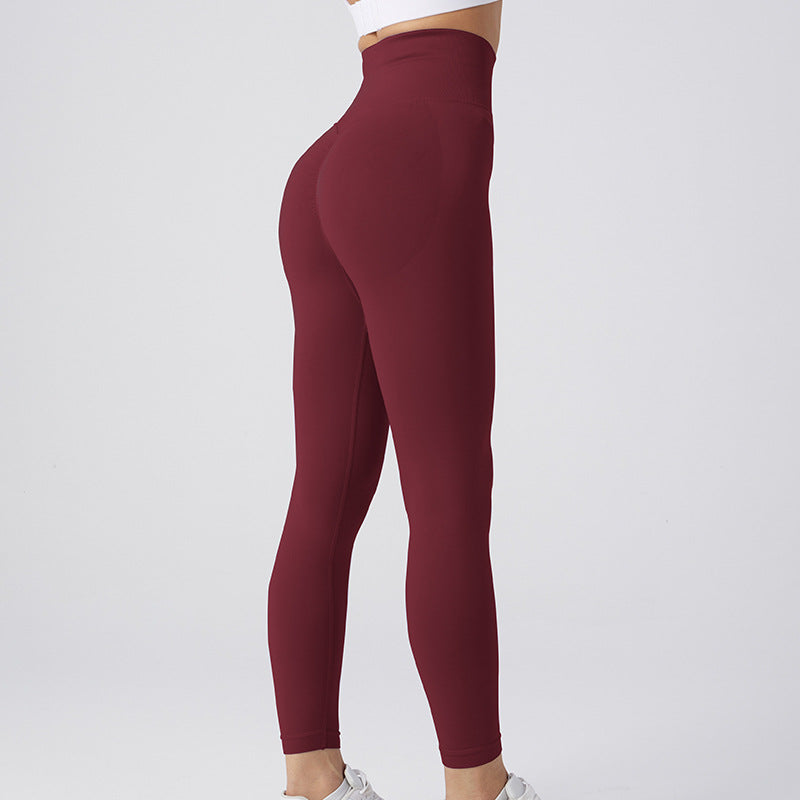 Burgundy high-waist seamless leggings with tummy-control shaping, full-length