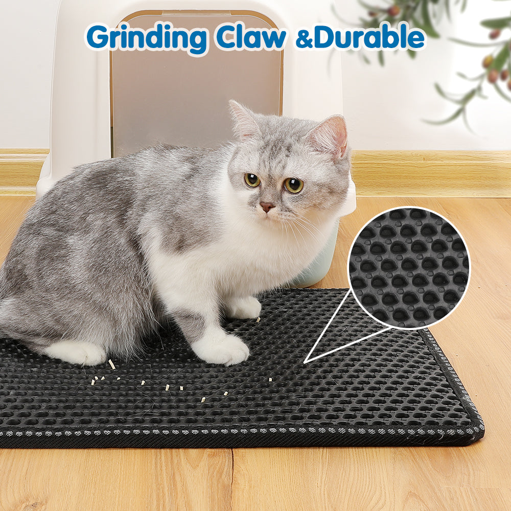 Black cat litter mat with hexagonal texture, close-up of the surface pattern