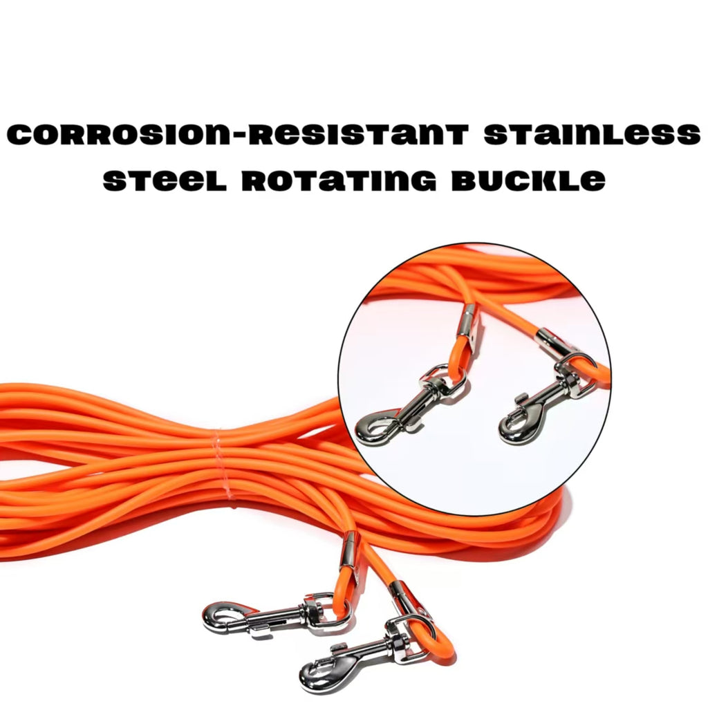 Orange dog tie-out leash close-up with stainless rotating buckle and metal snap hooks