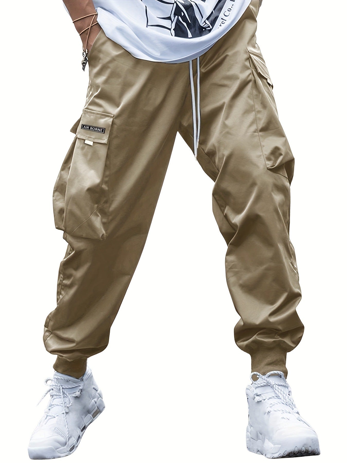 Khaki cargo jogger pants with drawstring hem and multi-pocket utility panels