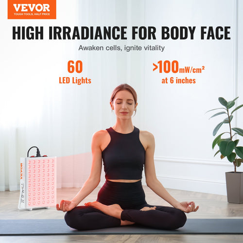 Red light therapy panel with LED grid; woman seated on yoga mat beside device