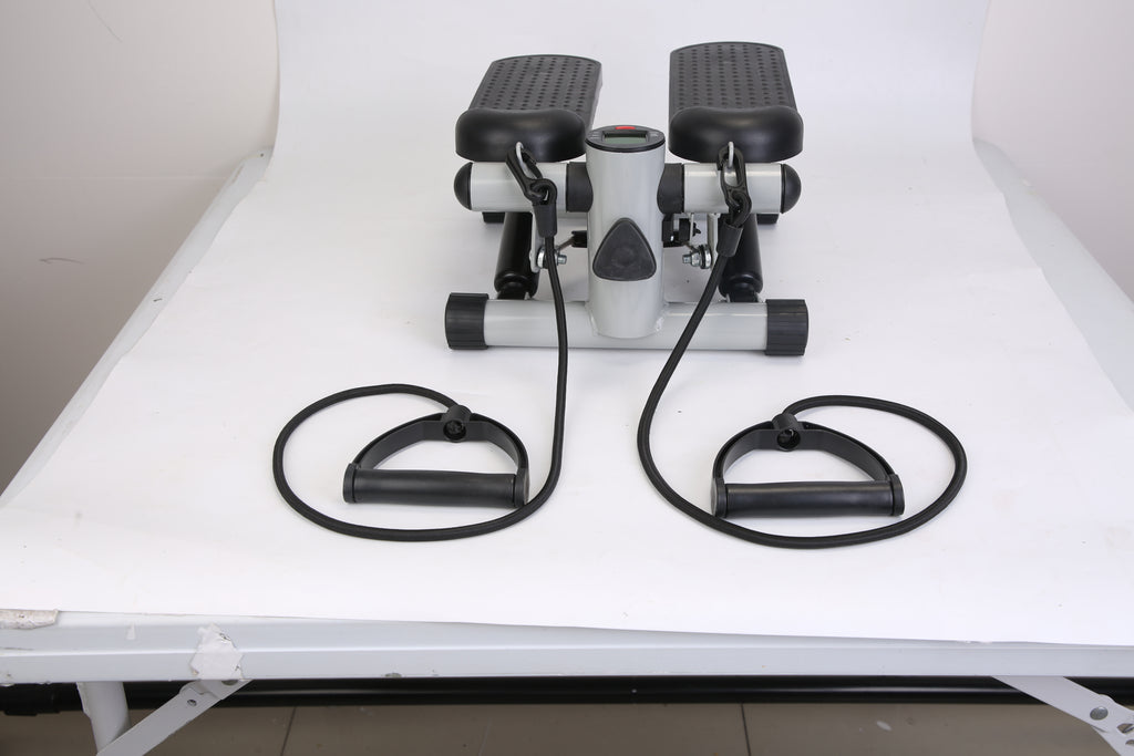 Mini fitness stepper with LCD, black resistance bands, and two adjustable foot platforms