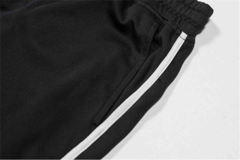 Men's quick-dry mesh fitness shorts, black with white side stripe piping