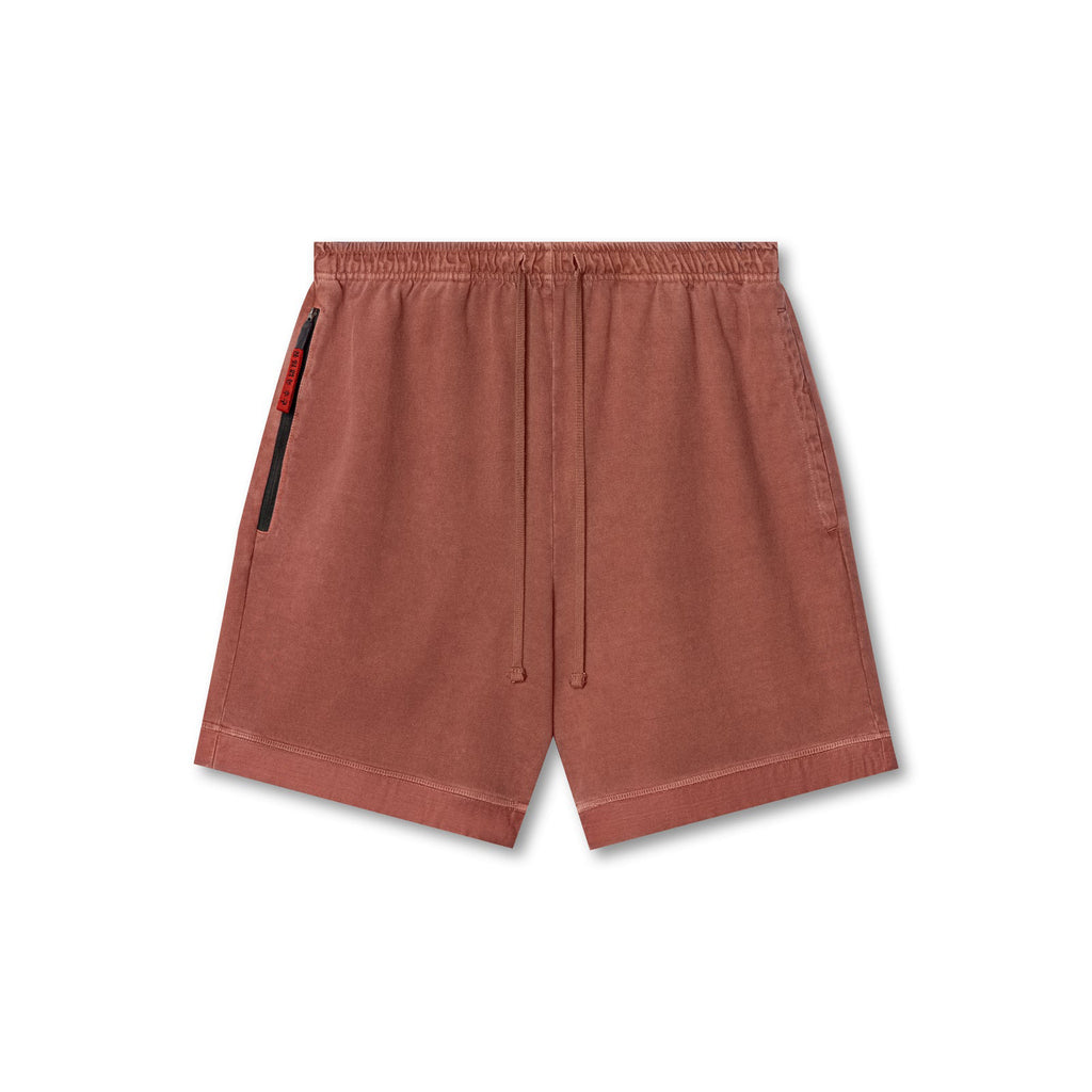 Rust-orange pull-on shorts with elastic waistband, drawstring, and side zip pocket