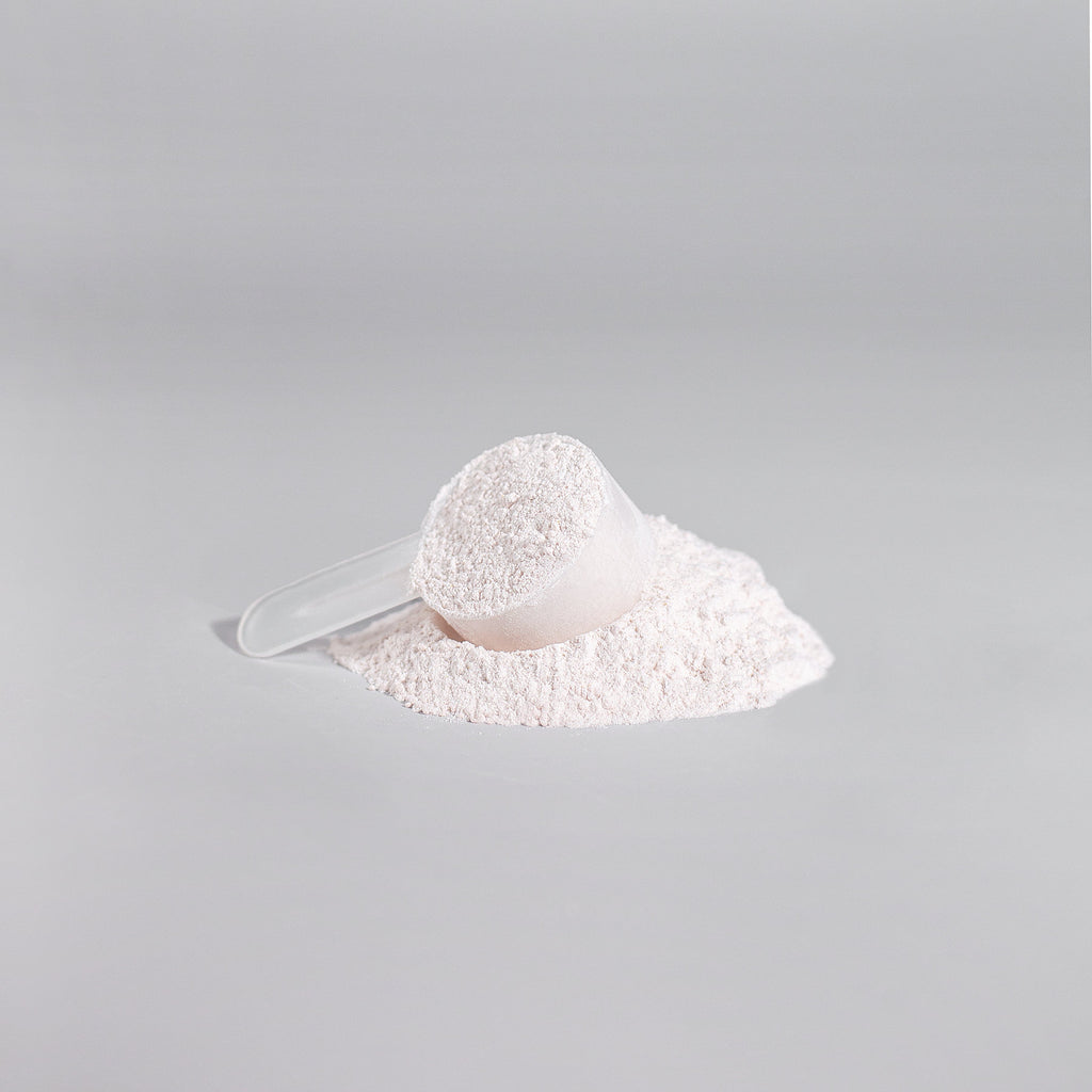 Scoop of white pre-workout powder on a spoon