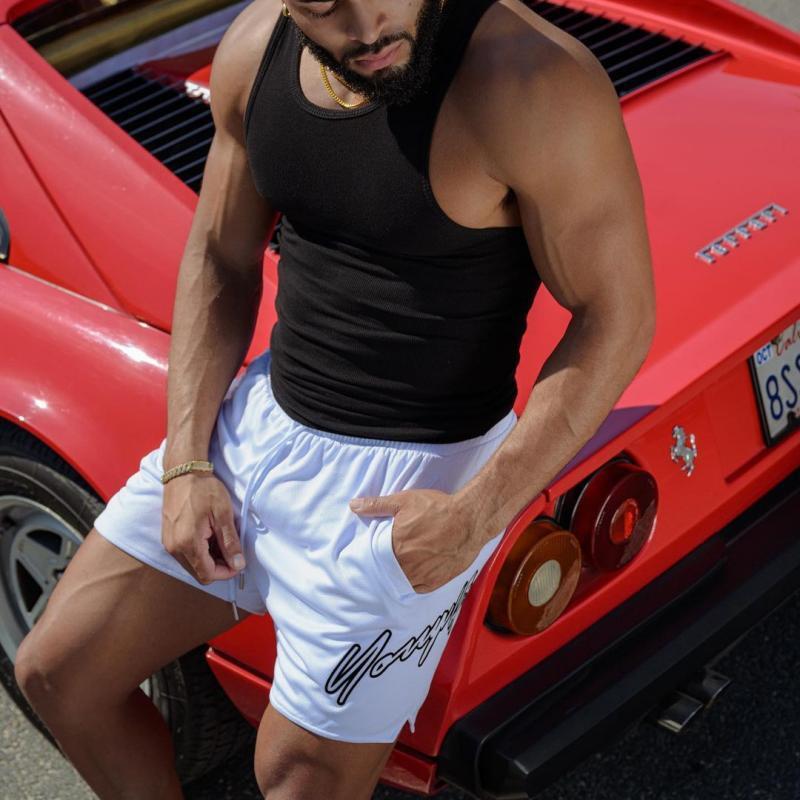 Light blue quick-dry training shorts with elastic waistband and drawstring, side logo.